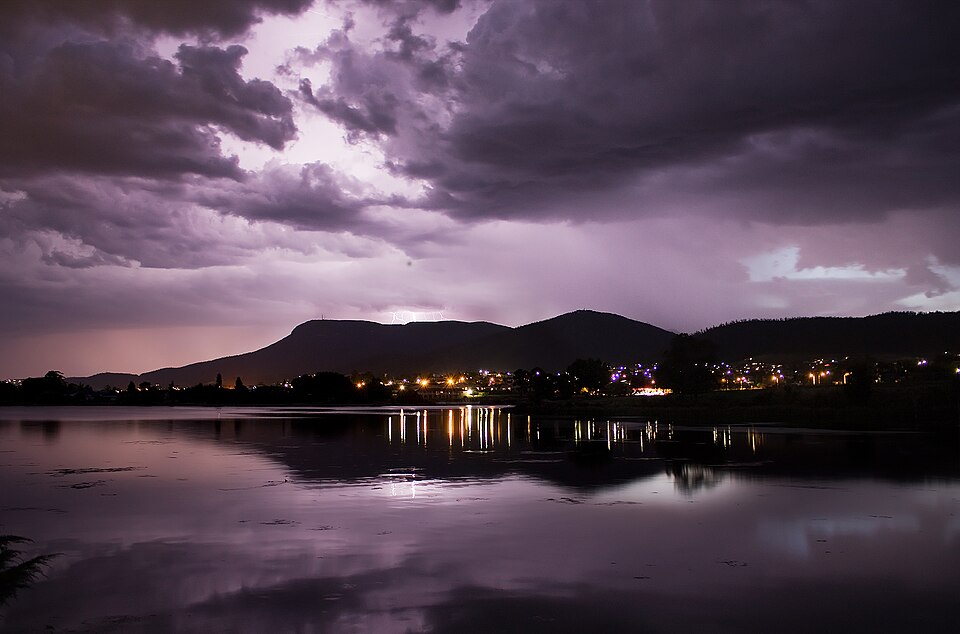 Sheet lightning lighting up the clouds over Mount Wellington, Tasmania, Australia